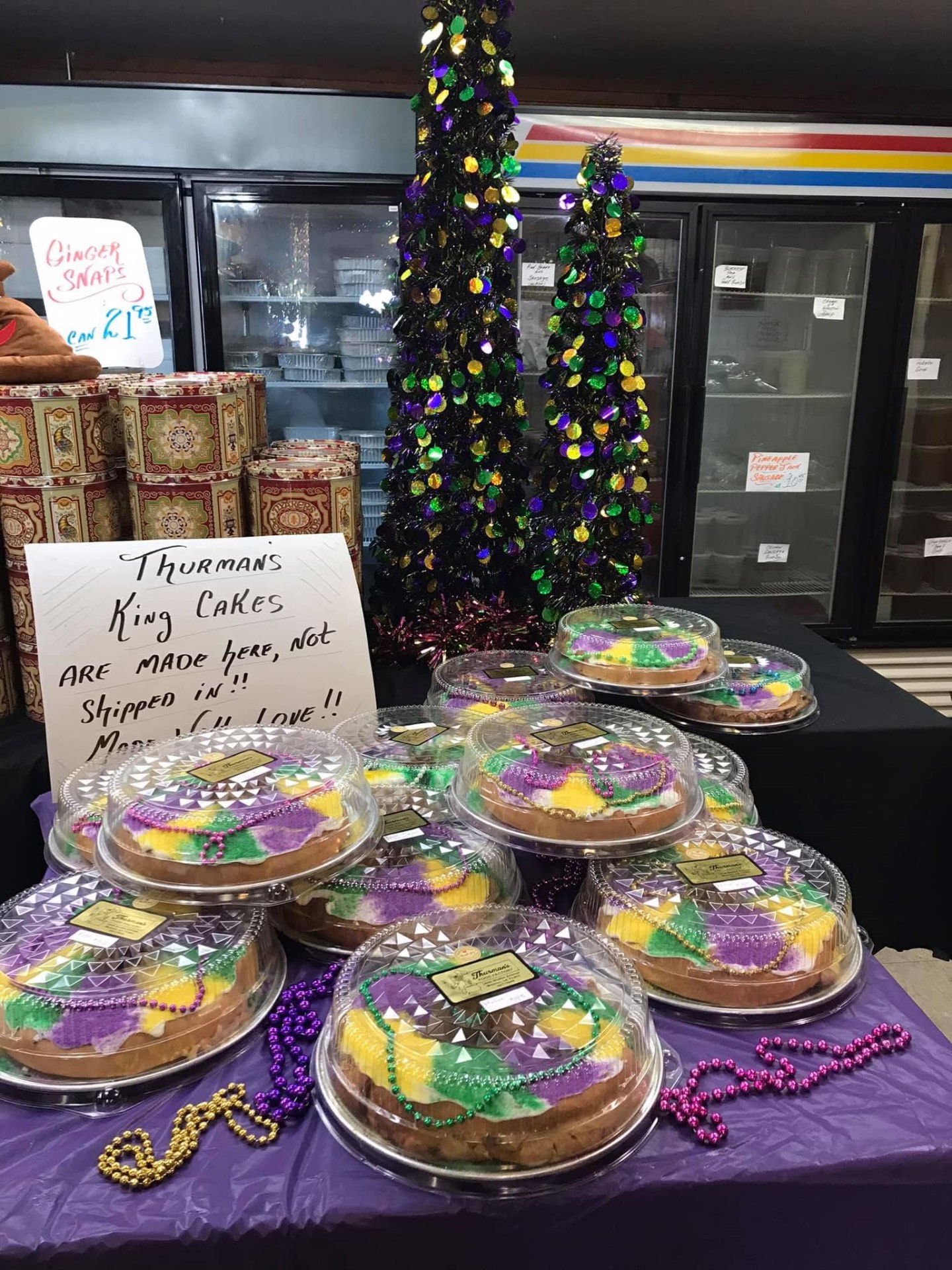 Display of packaged Mardi Gras King Cakes